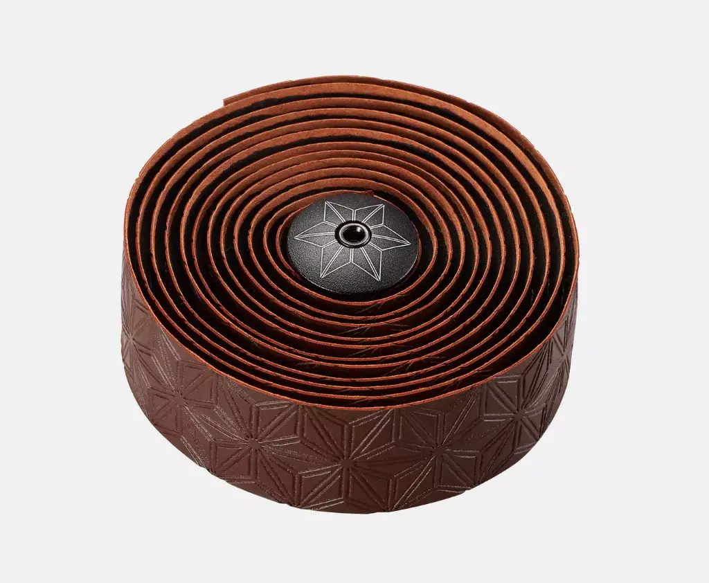 25522-303_GRIP_SUPER-STICKY-KUSH-TAPE-CLASSIC-COFFEE-ANO-BLK-PLUGS_DETAIL3.webp